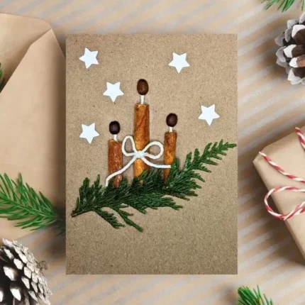 Handmade-Christmas-card-with-three-cinnamon-sticks-on-a-reen-branch