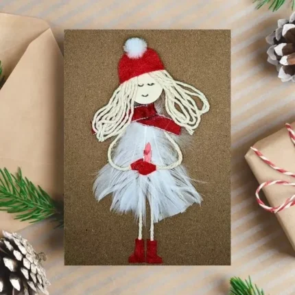 Hamemade-Christmas-card-with-snowgirl-made-of-feathers